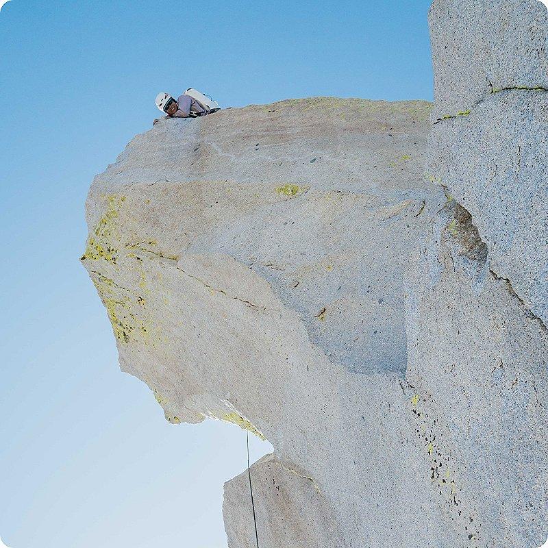 Shot of Miranda looking down at her fellow climber while belaying