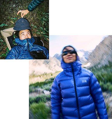 Blurry shot of a woman in a down jacket smiling at the camera.