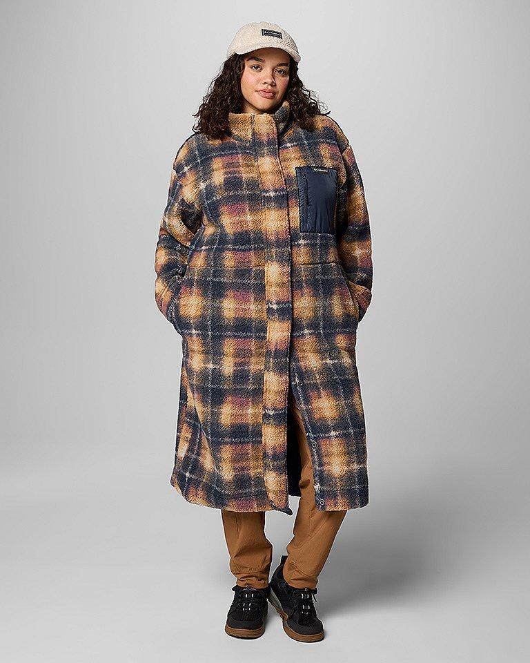 A stylish woman in a super cute, long fleece jacket.