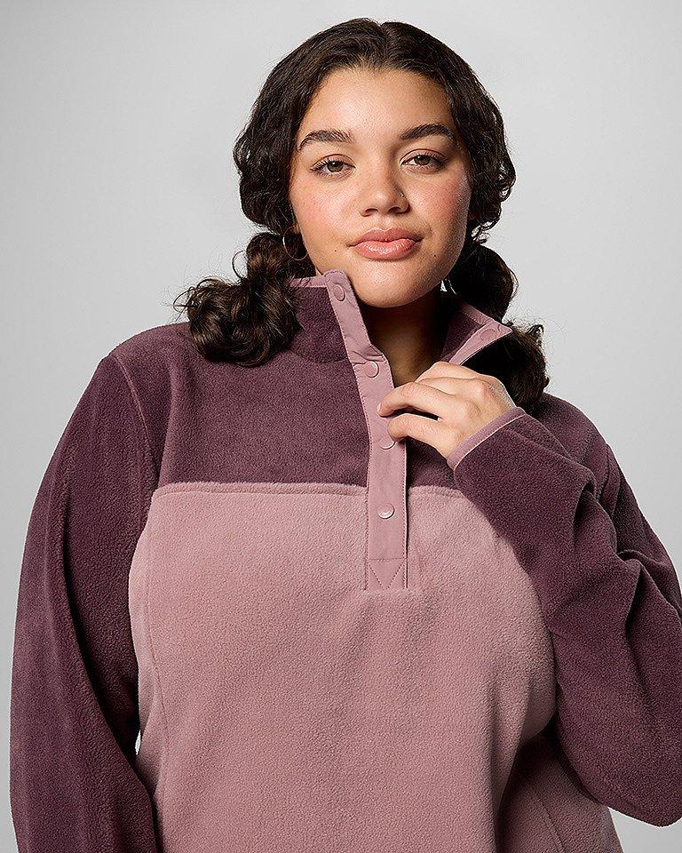 A woman in a cozy blue fleece with the hood up.