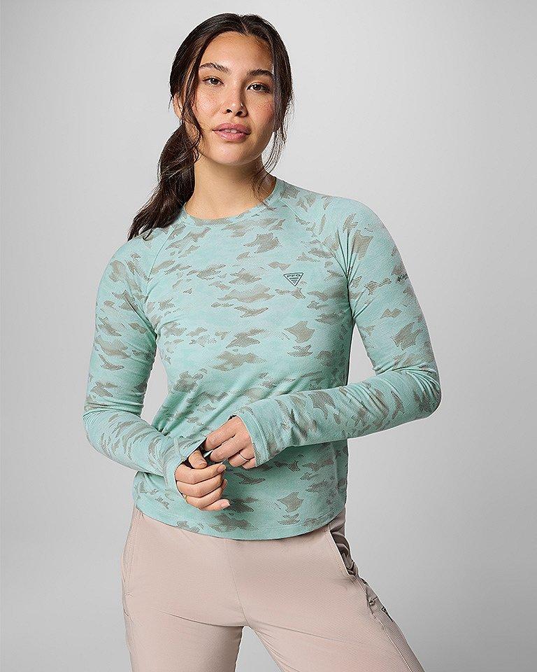 A woman in a stylish performance fishing gear outfit.