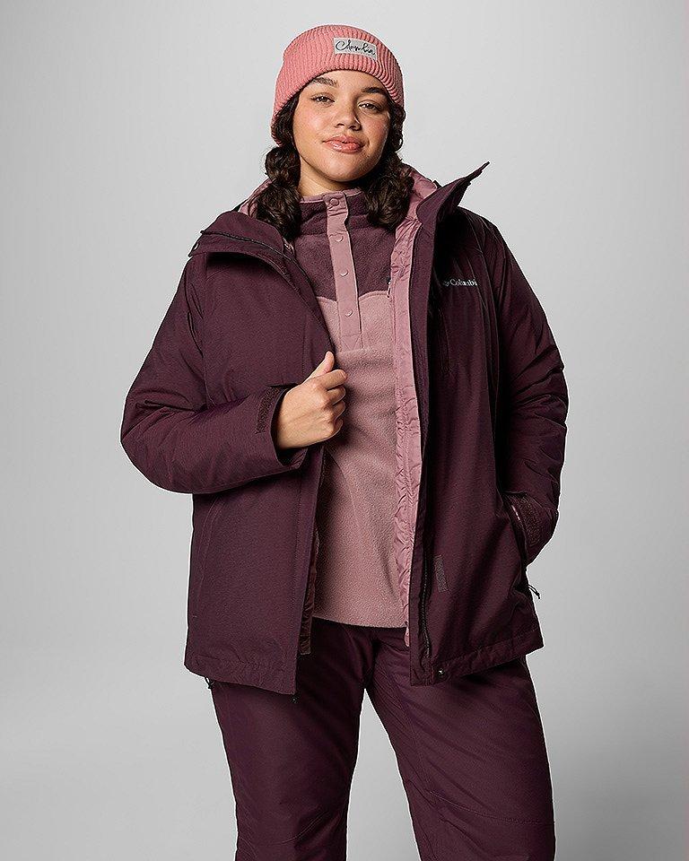 A woman in a casual looking ski outfit.