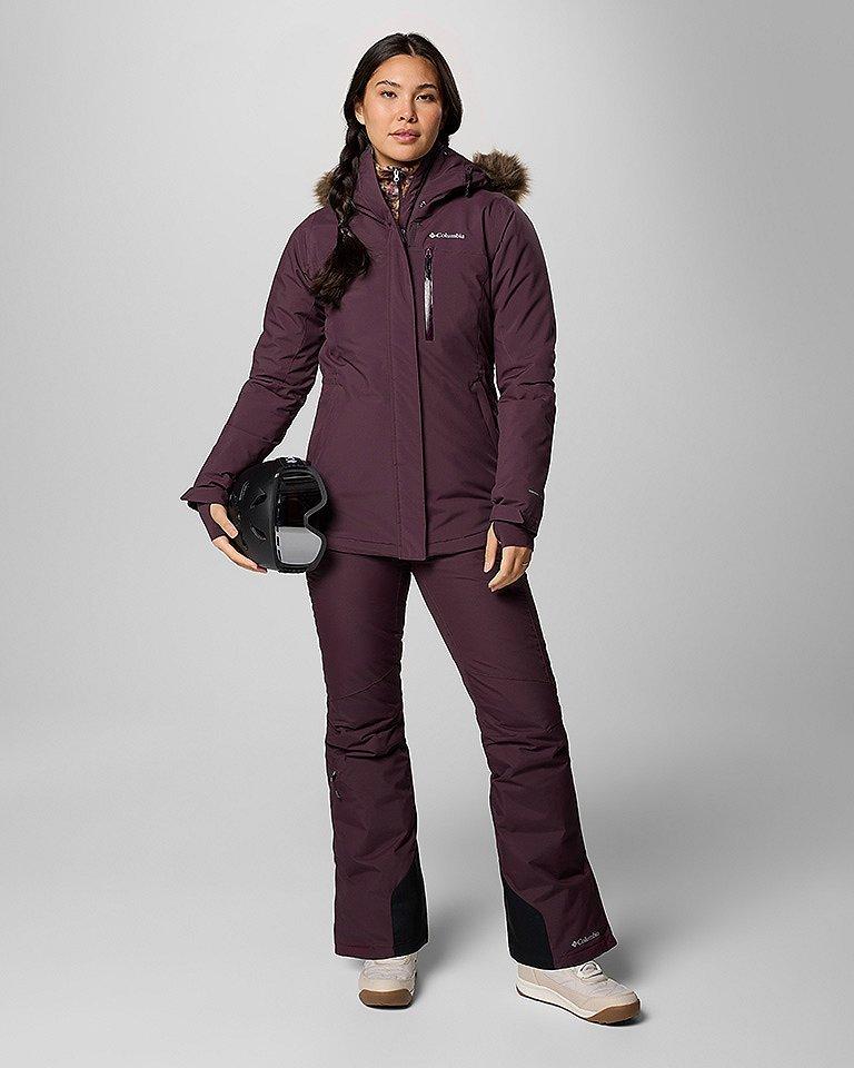 A woman in a head to toe ski outfit.