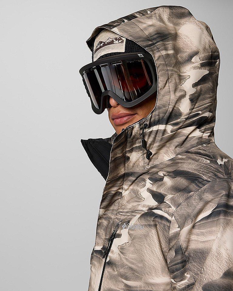 Man in a ski jacket with goggles.