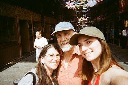 Kyra and her parents take a selfie, all smiles.