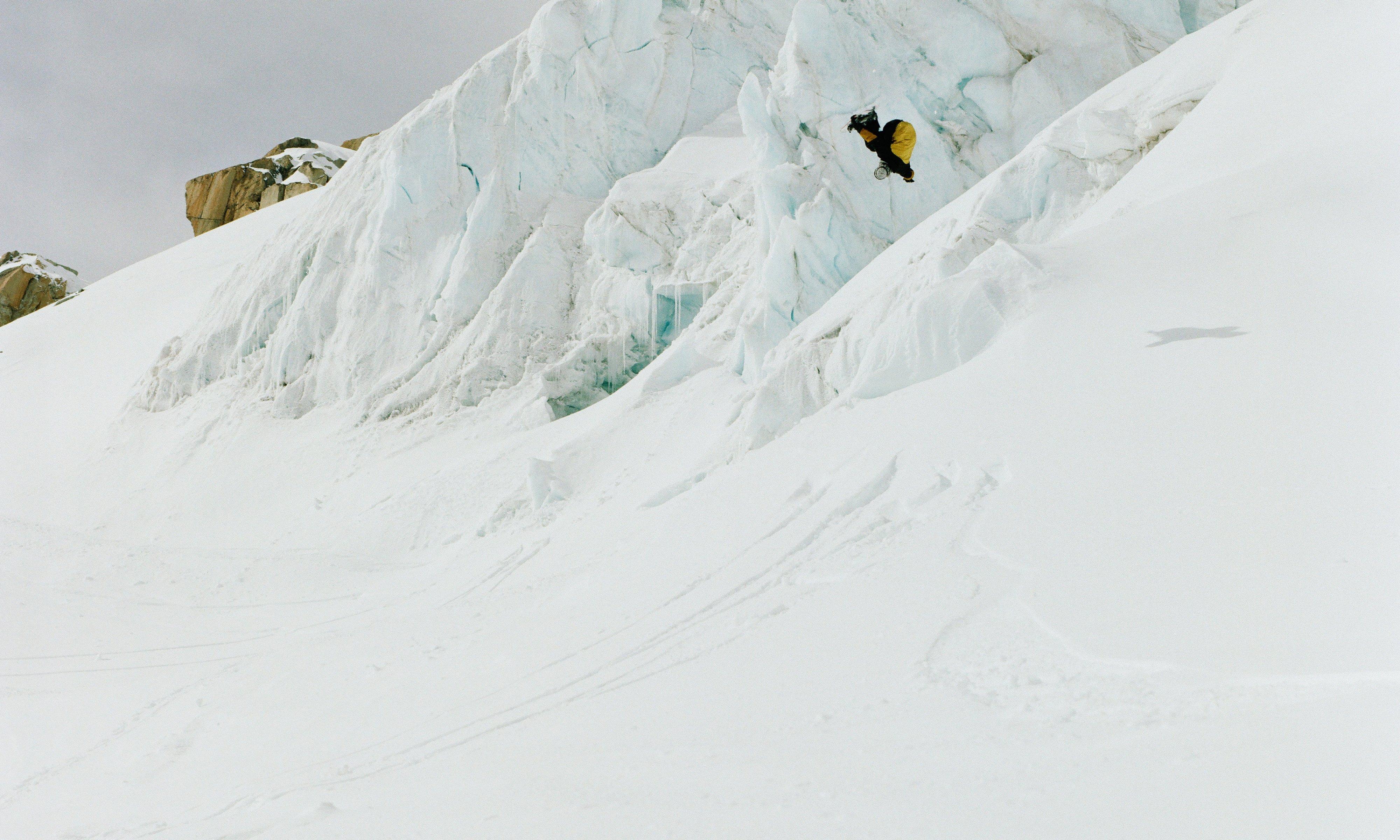 MHW athlete Sean Pettit suspended mid year doing a backflip whille snowboarding in British Columbia, kitted out in the Mythogen Gore-tex Pro Jacket and Bib.