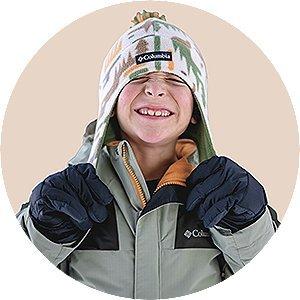 A close-up of a kids wearing a Columbia hat and jacket.