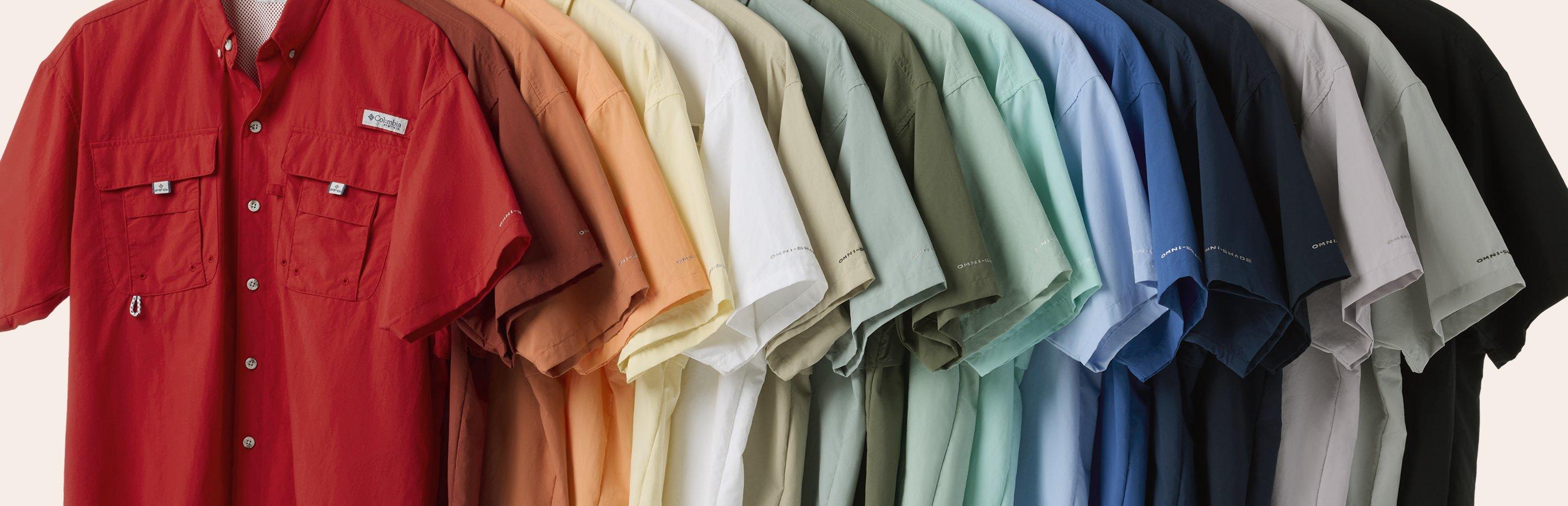 Rainbow of Bahama shirts on a clothing rack.