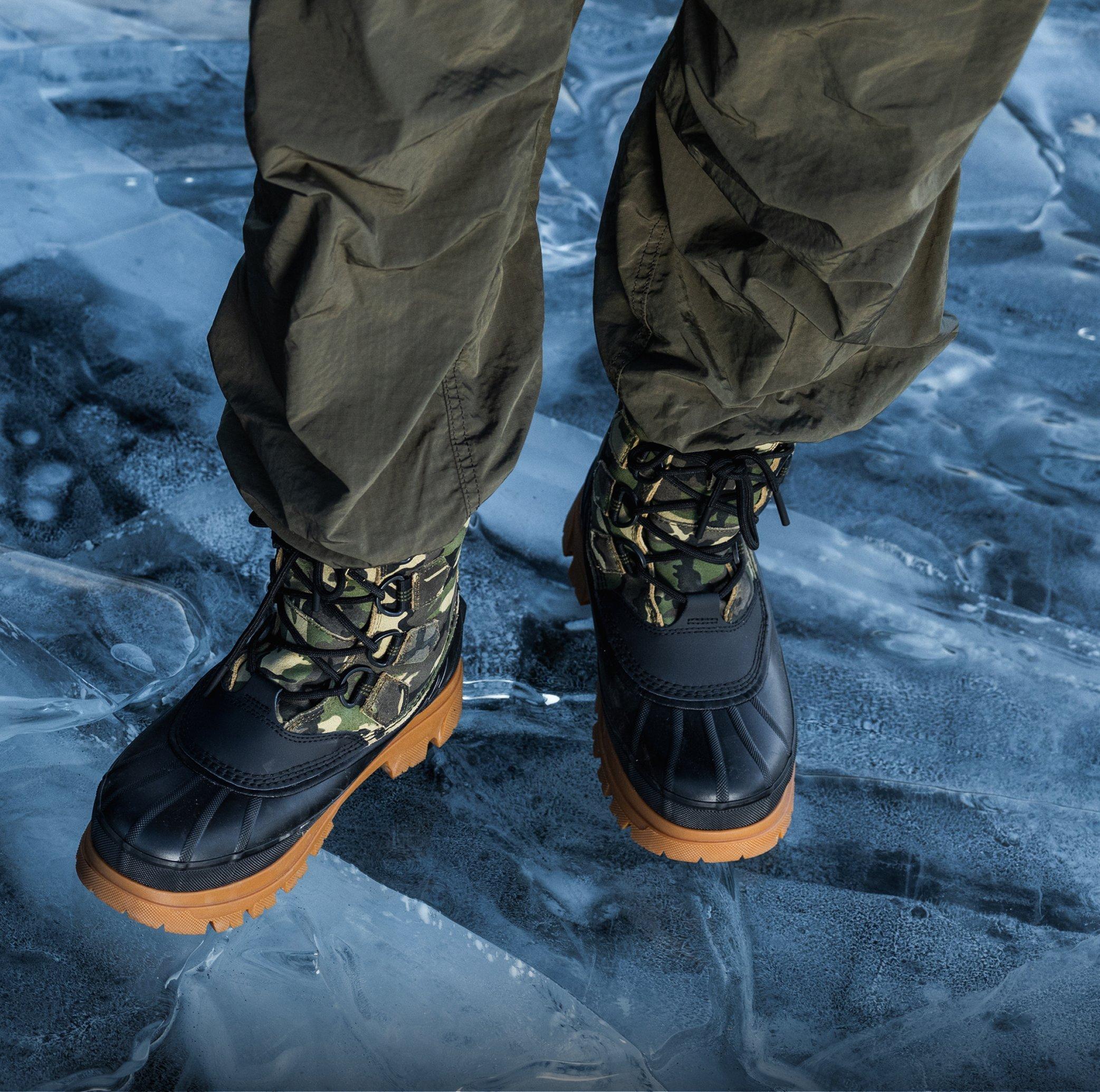 mens caribou horizon boots in snow