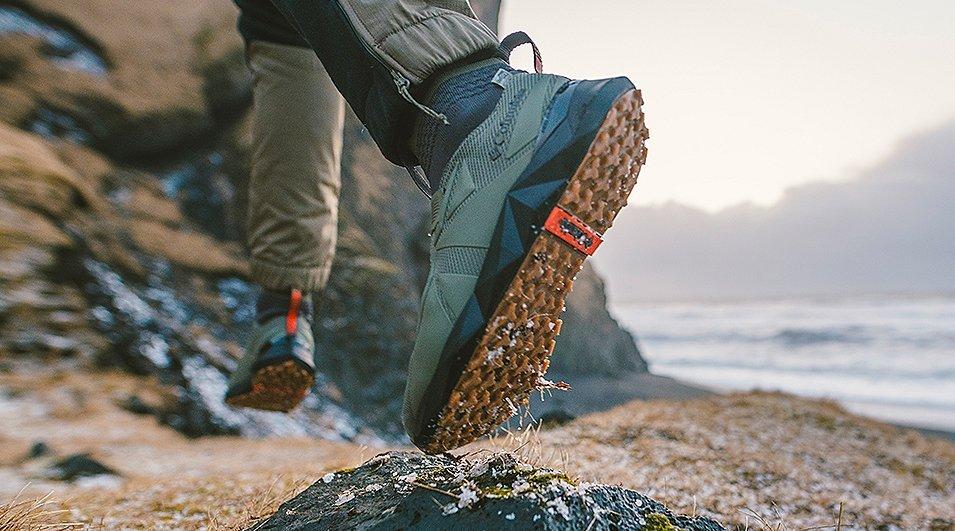 Close-up of someone hiking in outdoor sneakers.