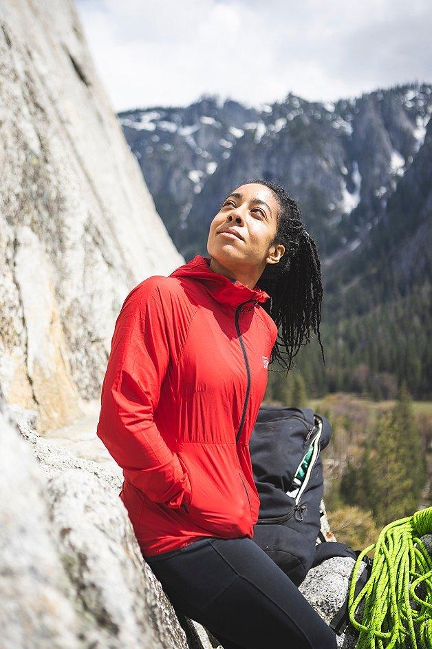 Genevive smiling up at a rockface in Yosemite.