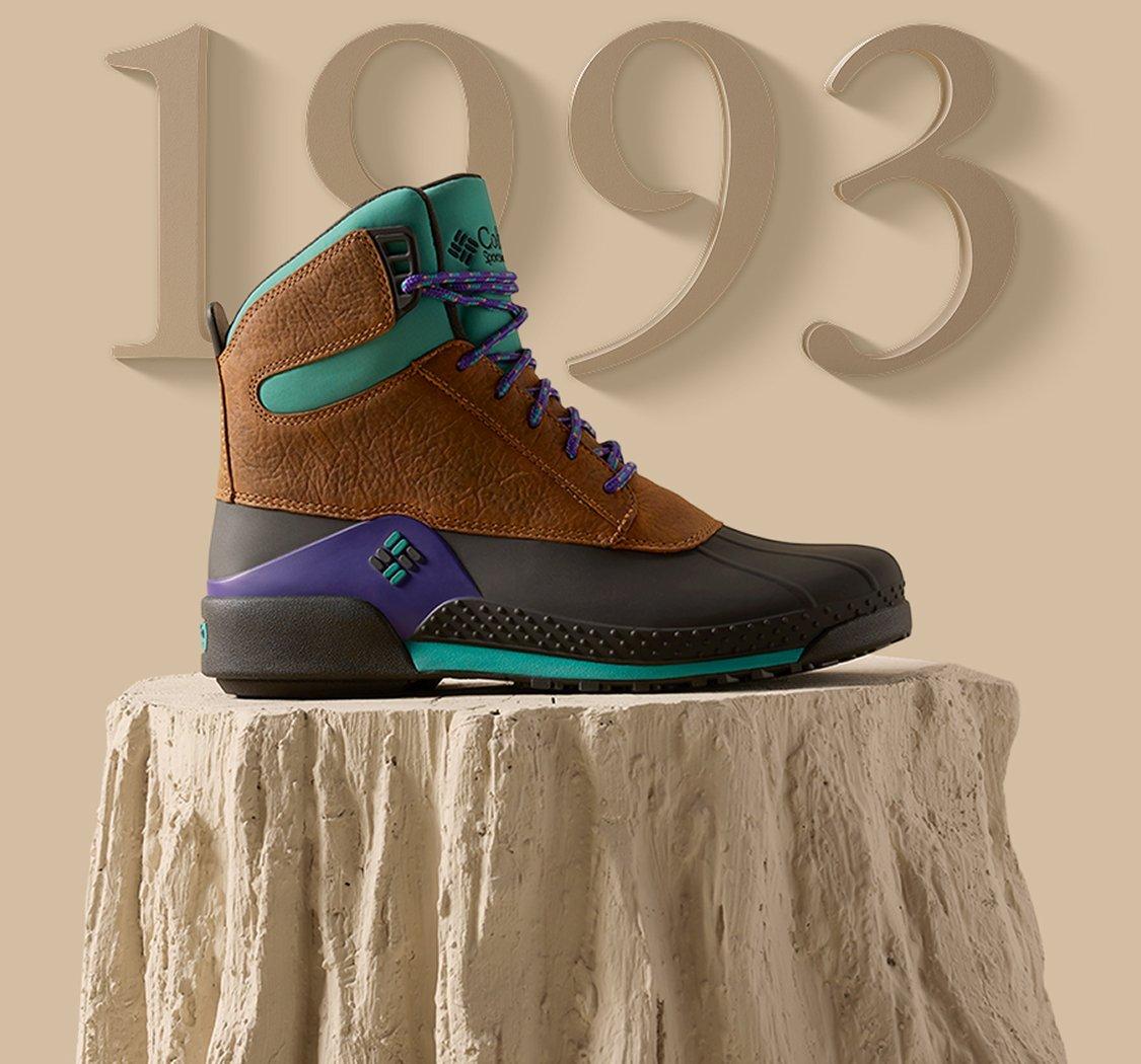 Boot posed on a stylized log display.