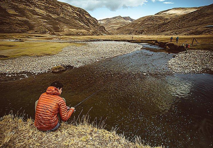 Fishing in chilly Peruvian conditions wearing the Ghost Whisperer Down Hoody.