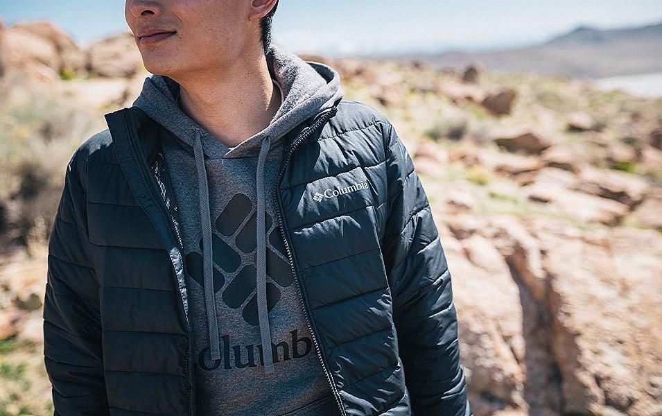 Close up of man wearing a sweatshirt and jacket.