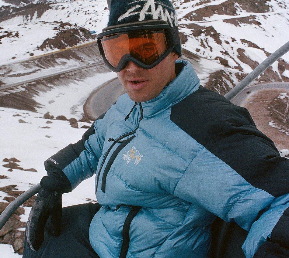 A snowboarder wearing a piece from the Mountain Hardwear x Stüssy Collab