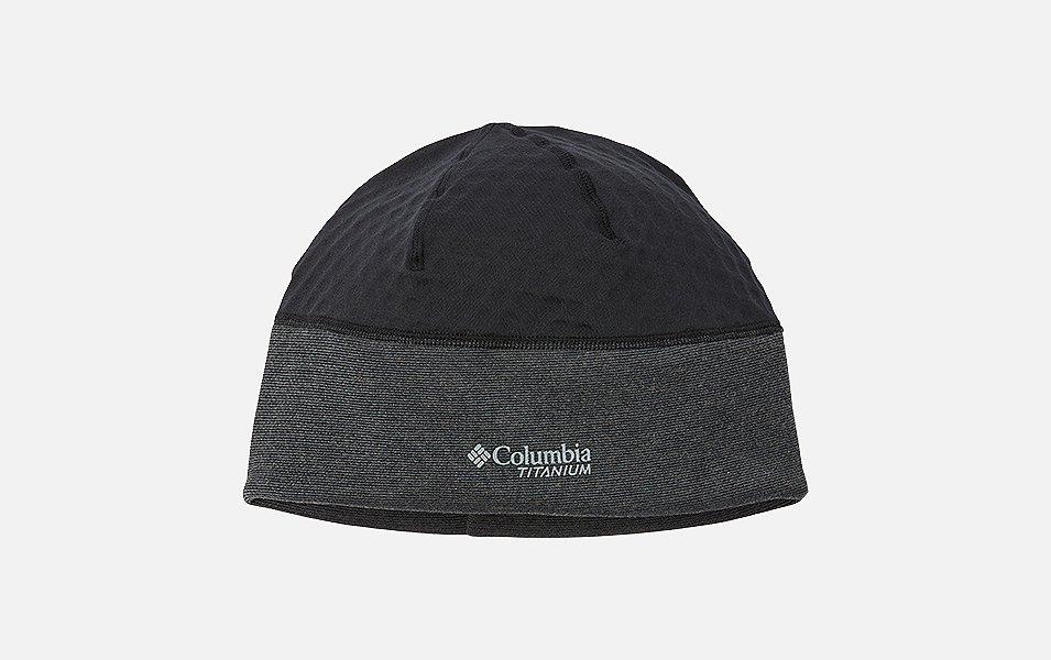 A product image of a man wearing Columbia Sportswear’s Sweat-Wicking Beanie against a white background. 
