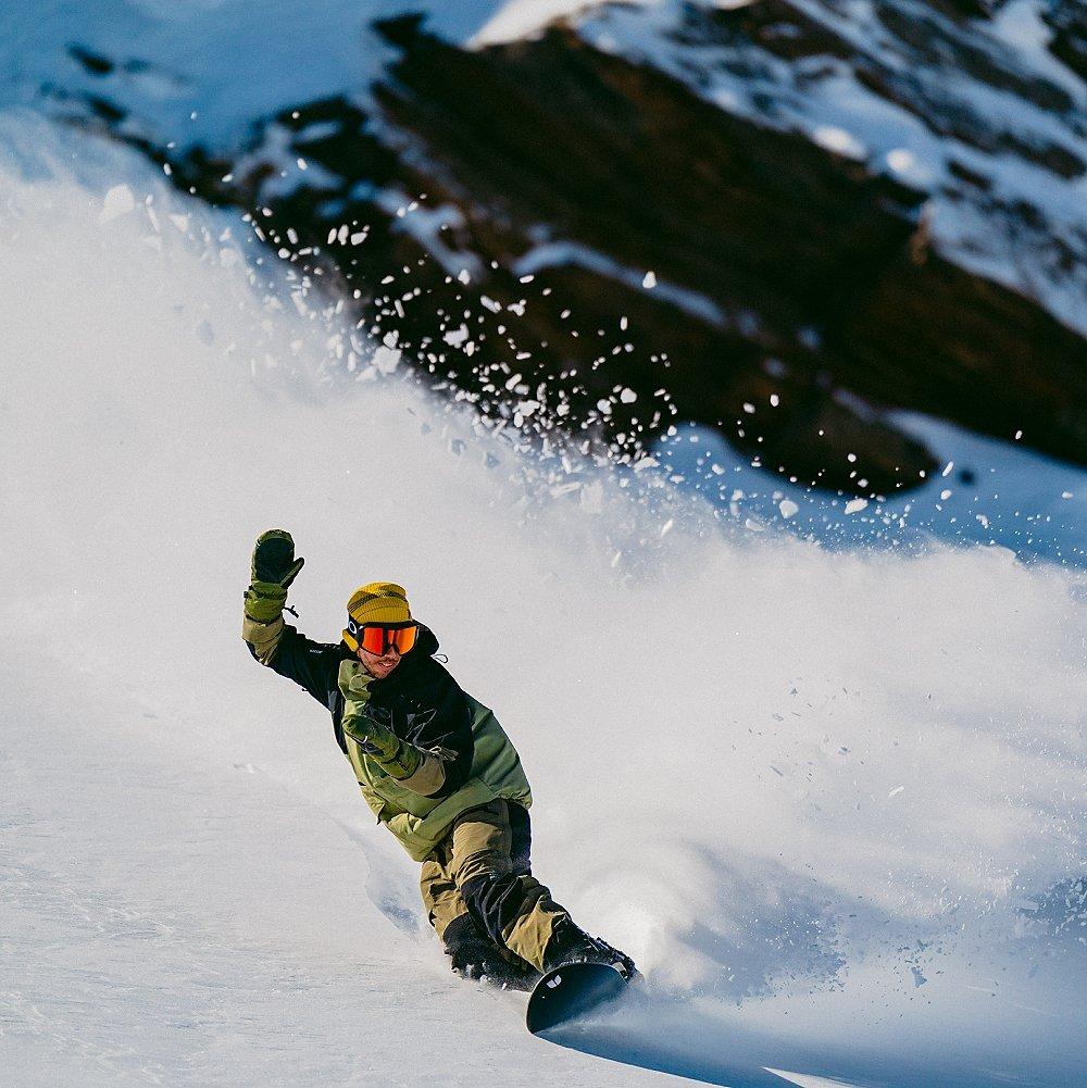 Gray Thomson snowboarding.