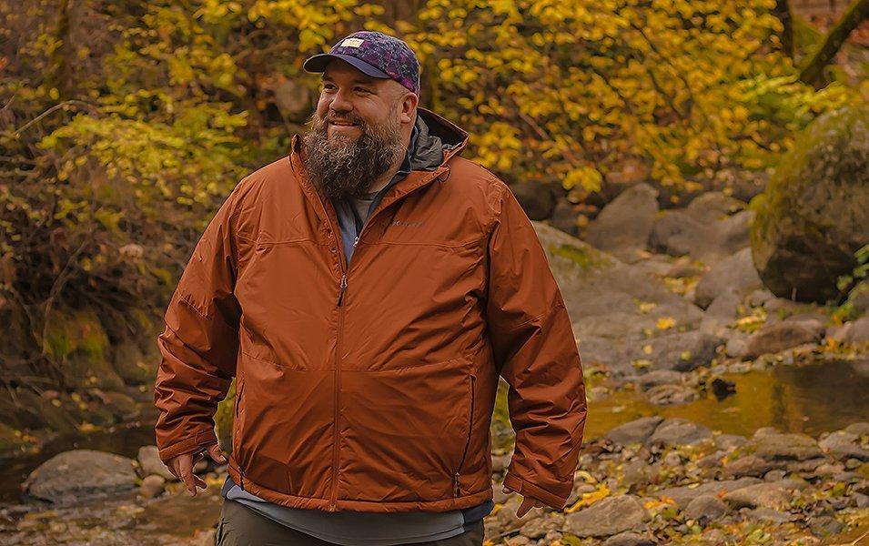 A man standing a rocky path.