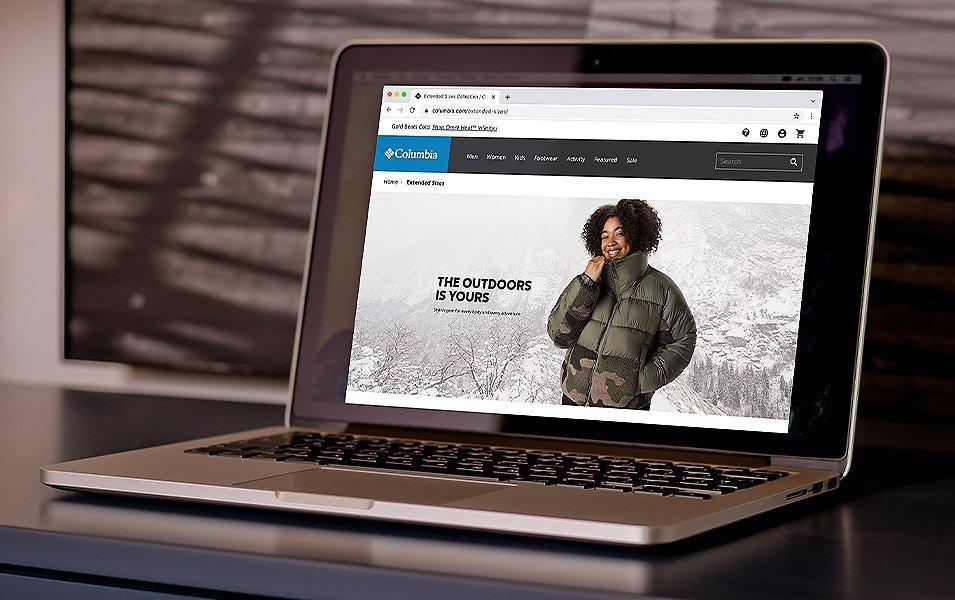 Close up of a laptop sitting on a table.