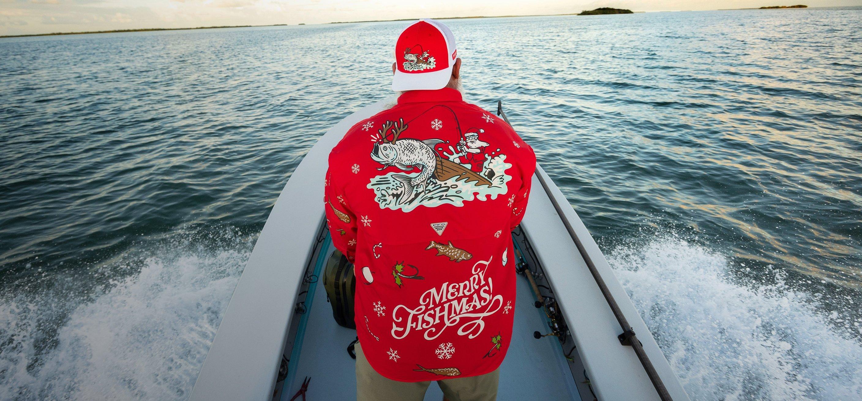 Red button-up fishing shirt and hat with Christmas-y prints, like gingerbread fish and candy cane hooks.