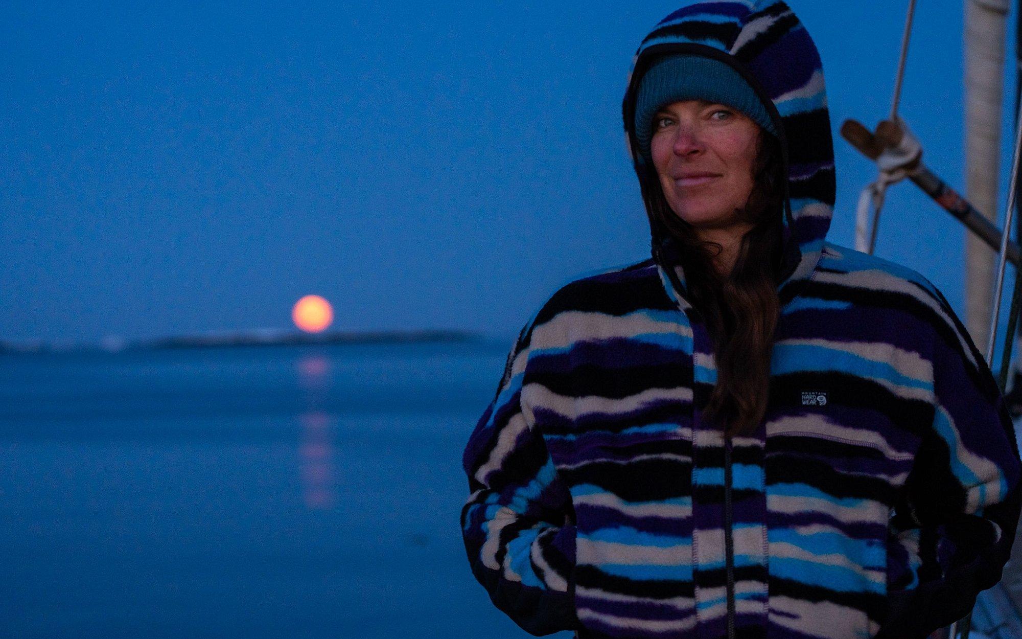 Rachael in in the moonlight on the sailboat.
