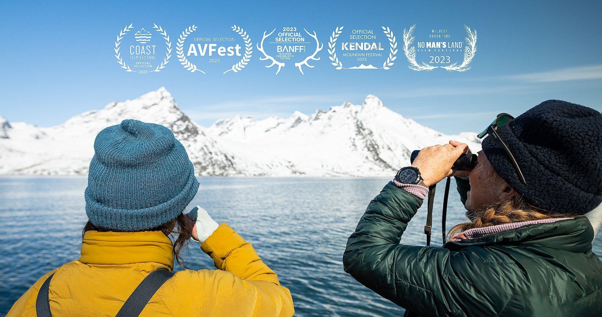 Going Greenland title card: Jessica and Rachael look out at a glacier in Greenland. Overlaid on the image, there are five film festival laurel accolades: Coast Film Festival Official Selection 2023, Official Selection AVFest 2023, 2023 Official Selection Banff Mountain Film and Book Festival, Official Selection Kendall Mountain Film Festival 2023, 'Wildest Adventure' No Man's Land Film Festival 2023.