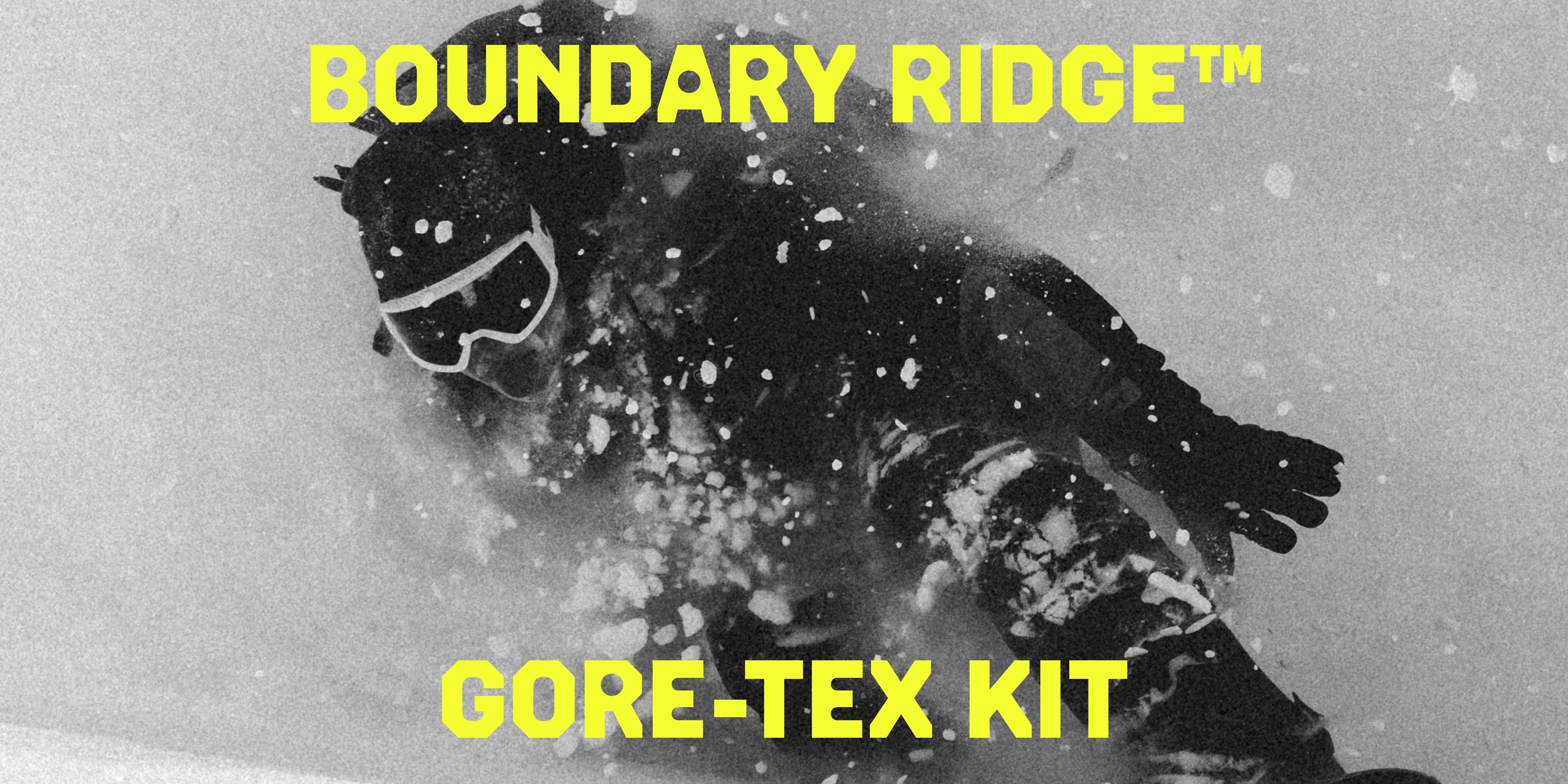 Close up of the black and white texture shot of the Boundary Ridge Gore-tex Kit in deep snow.