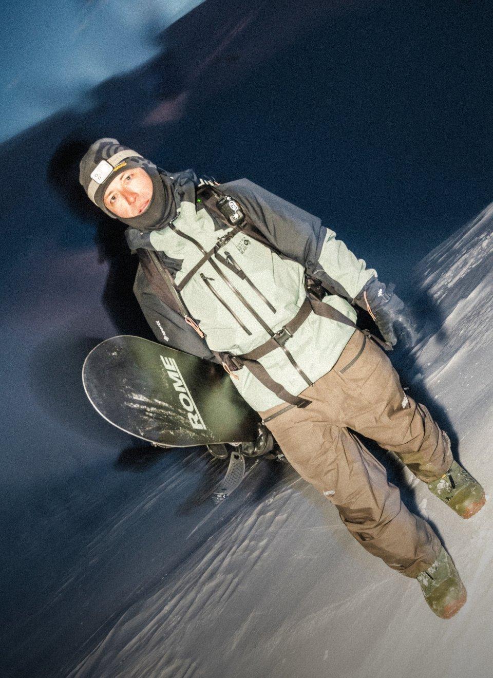 Hunter Knoll holding his snowboard.