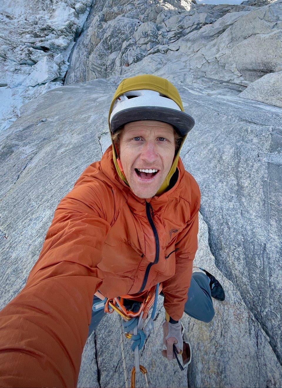 Tim Emmett taking a selfie while climbing.
