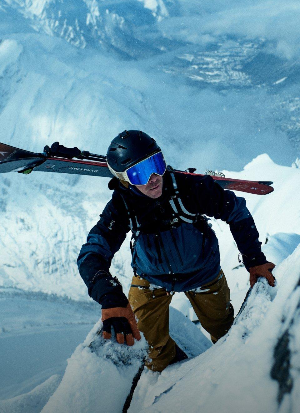 Vivian Bruchez scaling a snowy ridge wearing the Men's Mythogen™ GORE-TEX PRO Jacket.