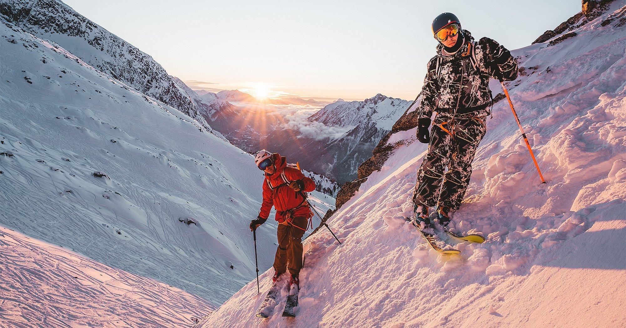 Viv on a steep slope in the backcountry, looking down, taking in his surroundings. 