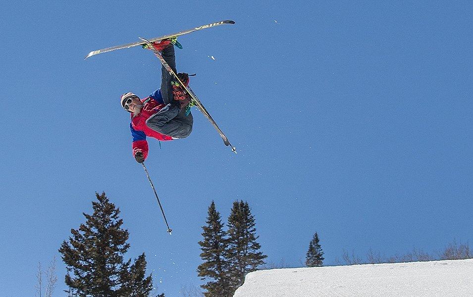 Hotdog Hans is pictured shooting out of the halfpipe in a red vintage ski jacket.
 