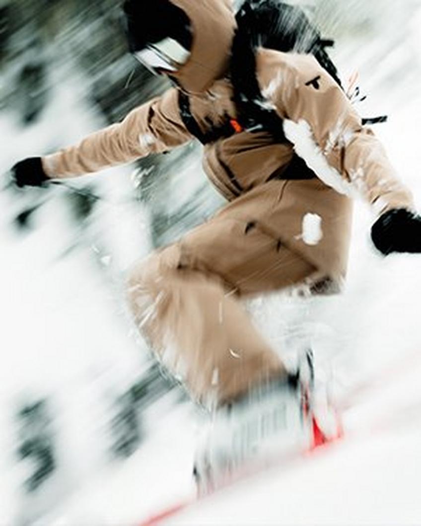 Women skiing in blue ski jacket and pants.