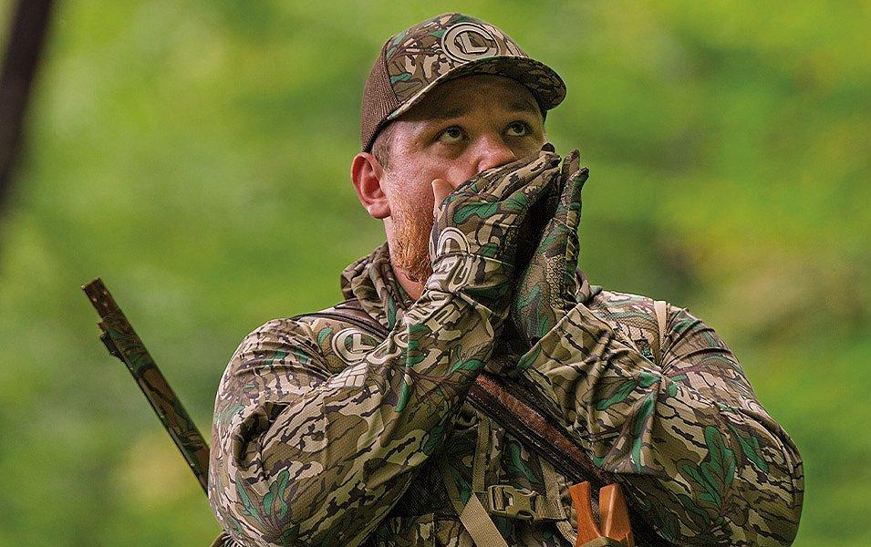 Luke Combs makes a turkey call wearing gloves that keep his hands warm, dry and protected without restricting finger dexterity.