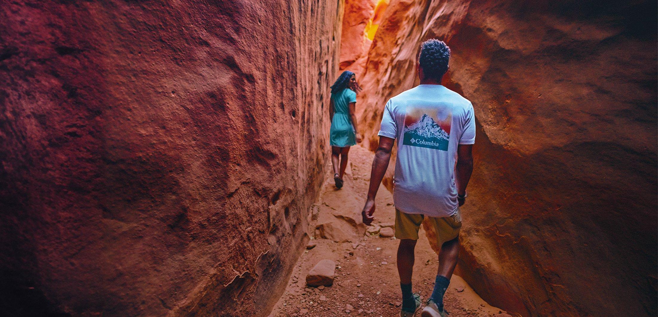 Two people walking through the snow in cozy fleece gear.