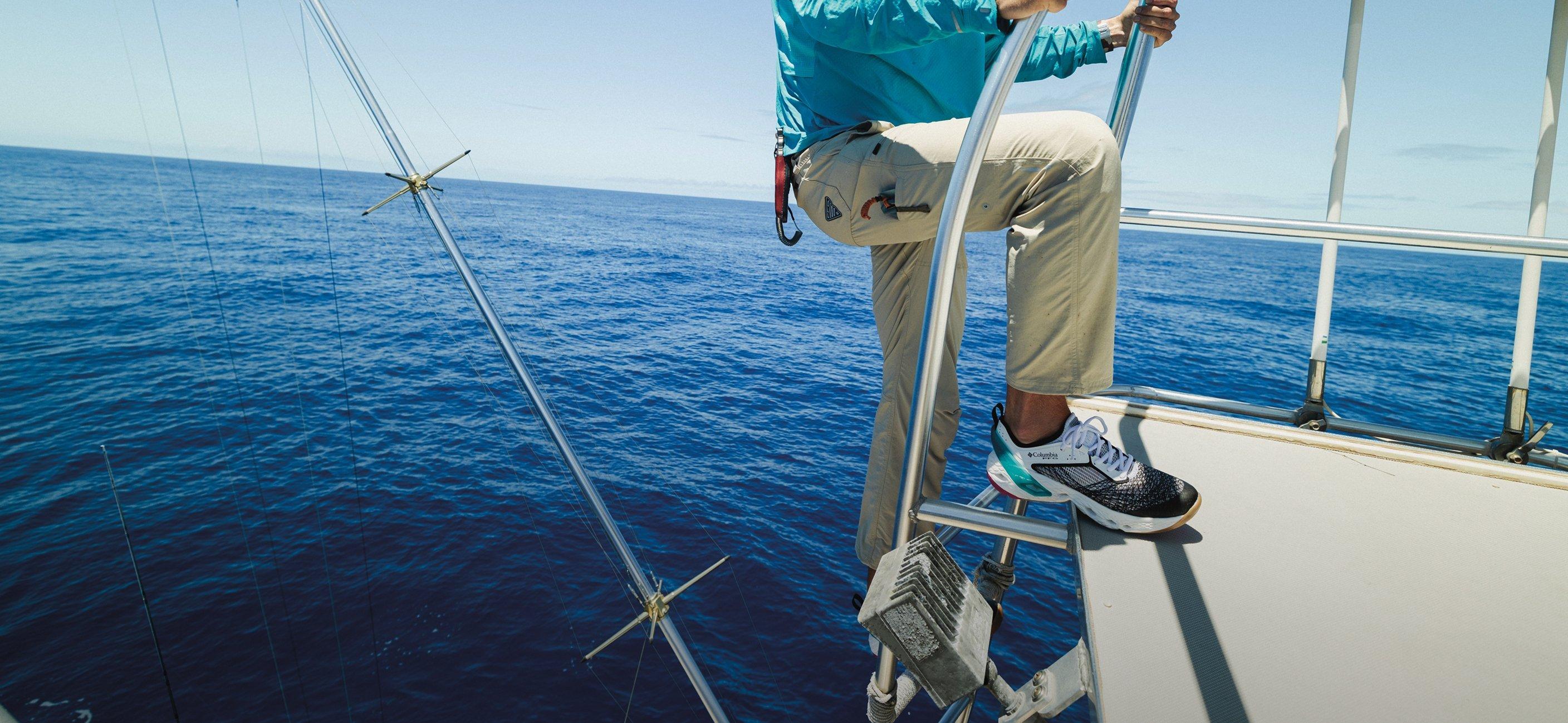 Close up of angler wearing PFG pant on a boat