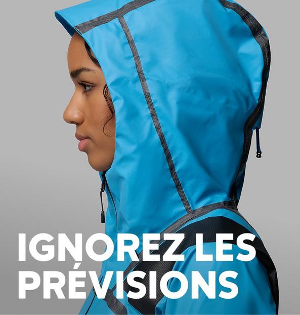 Profile of a woman in a blue rain jacket.