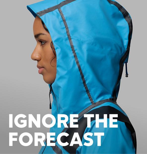 Profile of a woman in a blue rain jacket.