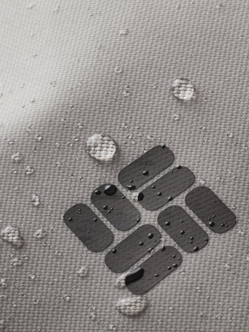 Gray fabric with water beaded on it and the Columbia logo.