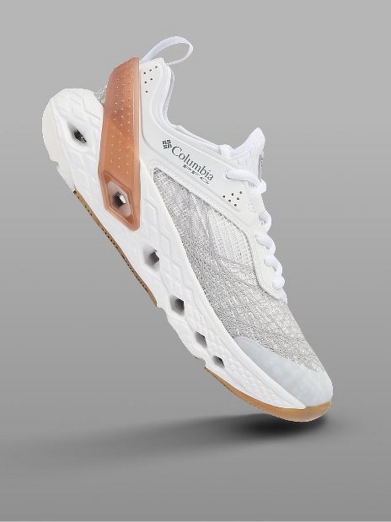 White athletic shoe with tan leather accents, mesh panels, and gum rubber sole shown at an angle.