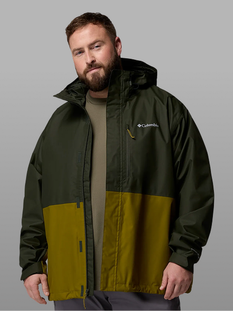 A man wearing a green rain jacket.