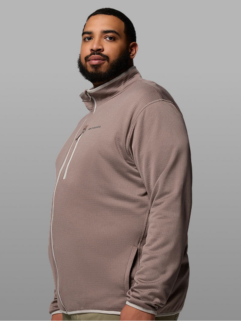 A man wearing a mauve fleece zip-up.