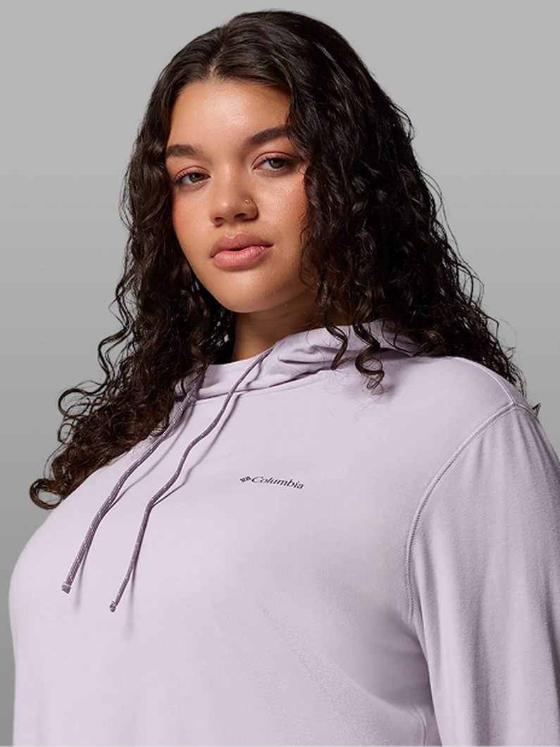 A woman wearing a purple hoodie.