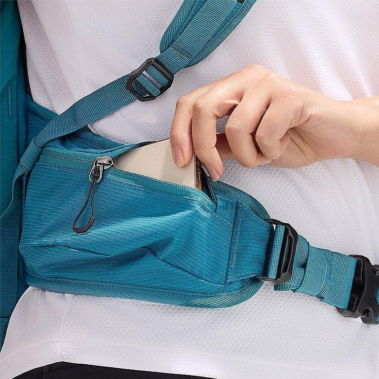 Close-up of a woman buttoning a Silver Ridge shirt. 