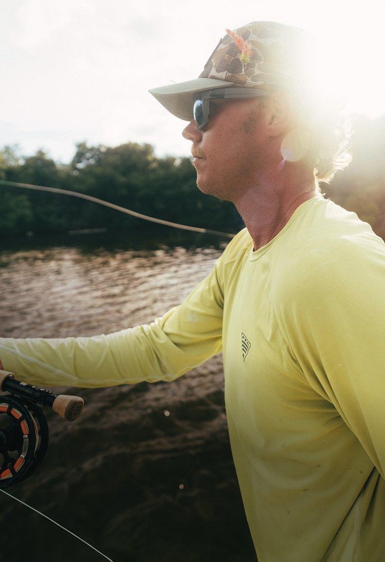 Smiling angler on the water.