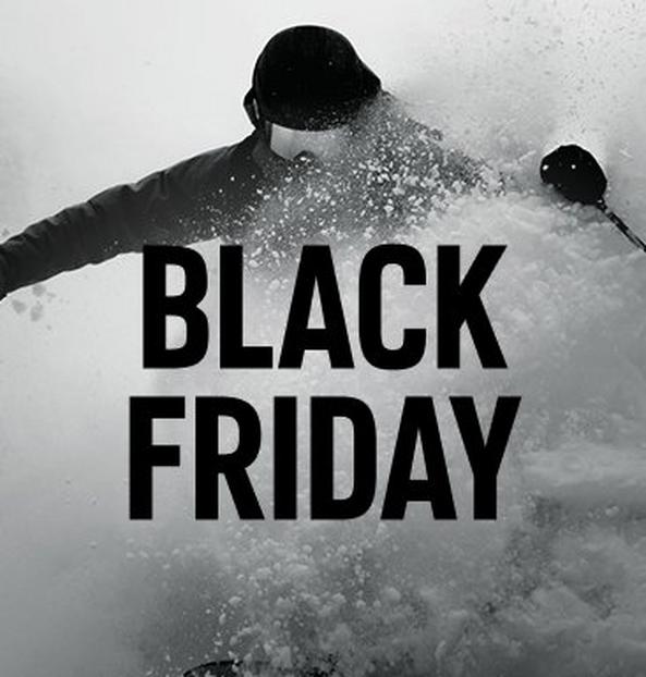 A skier busting through a pile of soft snow.