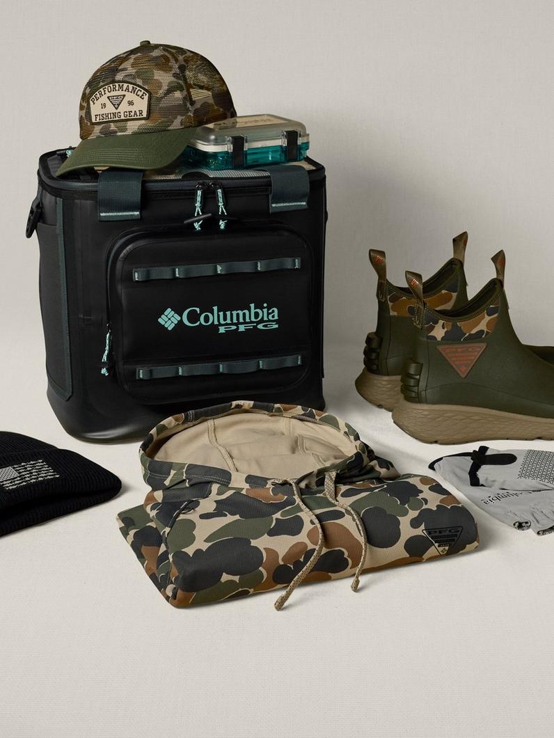 Arrangement of Performance Fishing Gear, including a cooler, camo fleece, and deck boots.