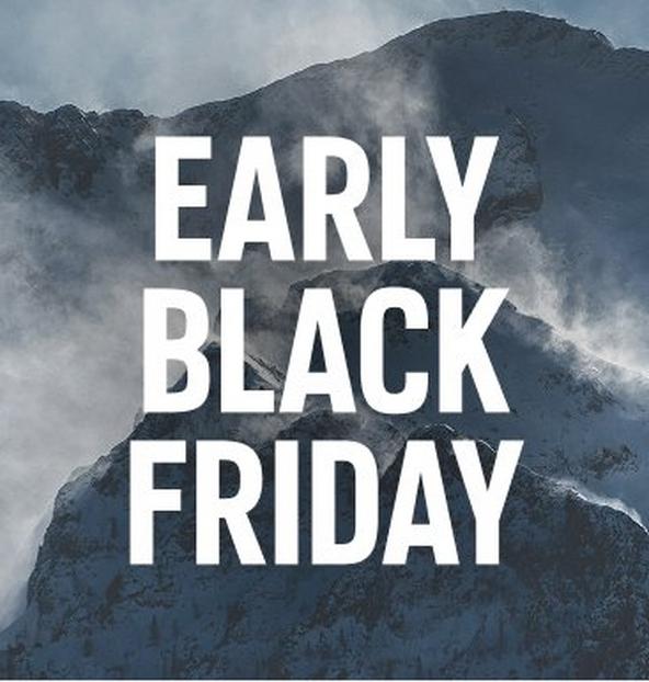 A snowy mountain scene with clouds settling among the peaks.