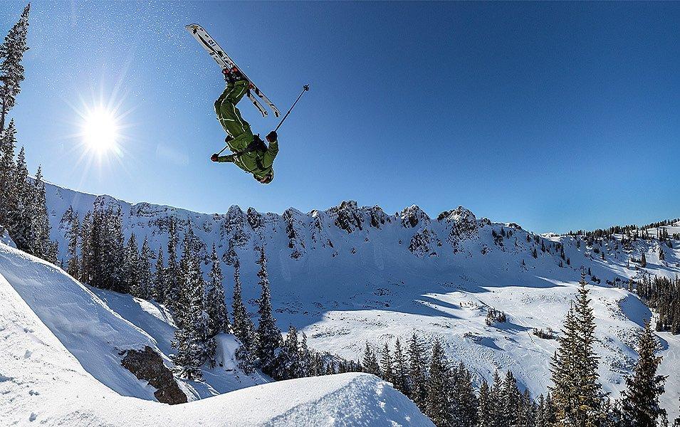 Columbia Sportswear Ski Ambassador and Olympic athlete, Alex Ferreira, soars off a jump while eying a landing for a backflip.