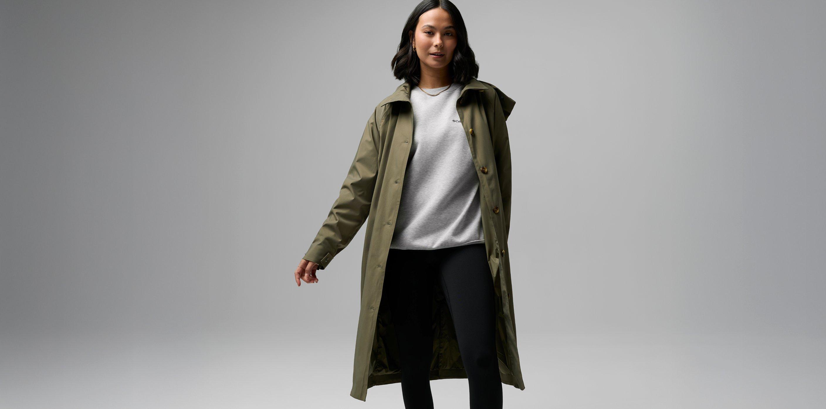 A women wearing a blue rain jacket